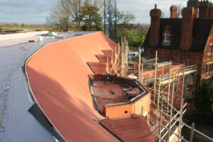 Curved tile roofs on new care home