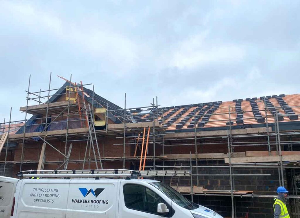 Church tiled roof work progress